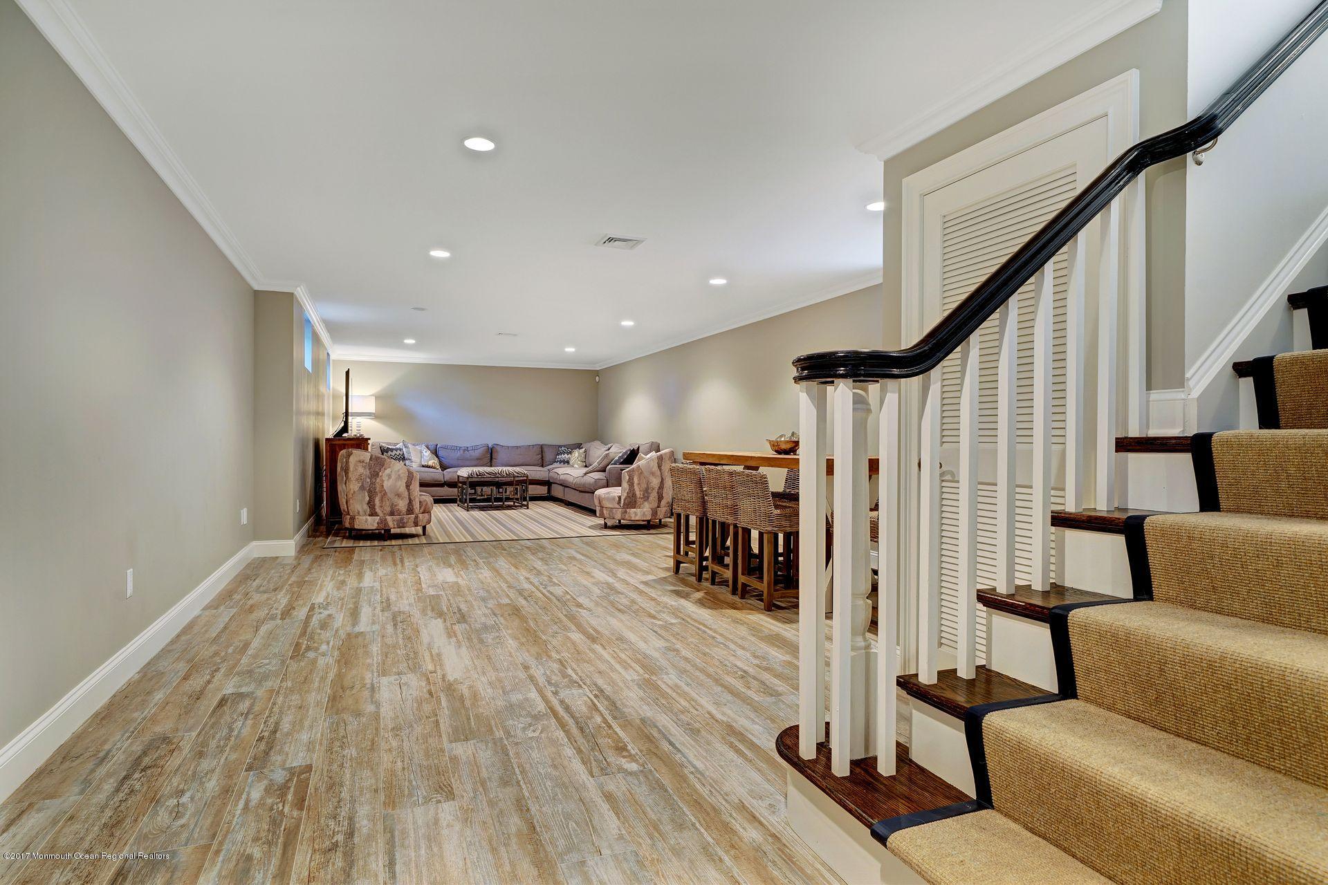 401 Monmouth Avenue Spring Lake, NJ 07762 - Photo 22 of 24 a living room with furniture and a wooden floor