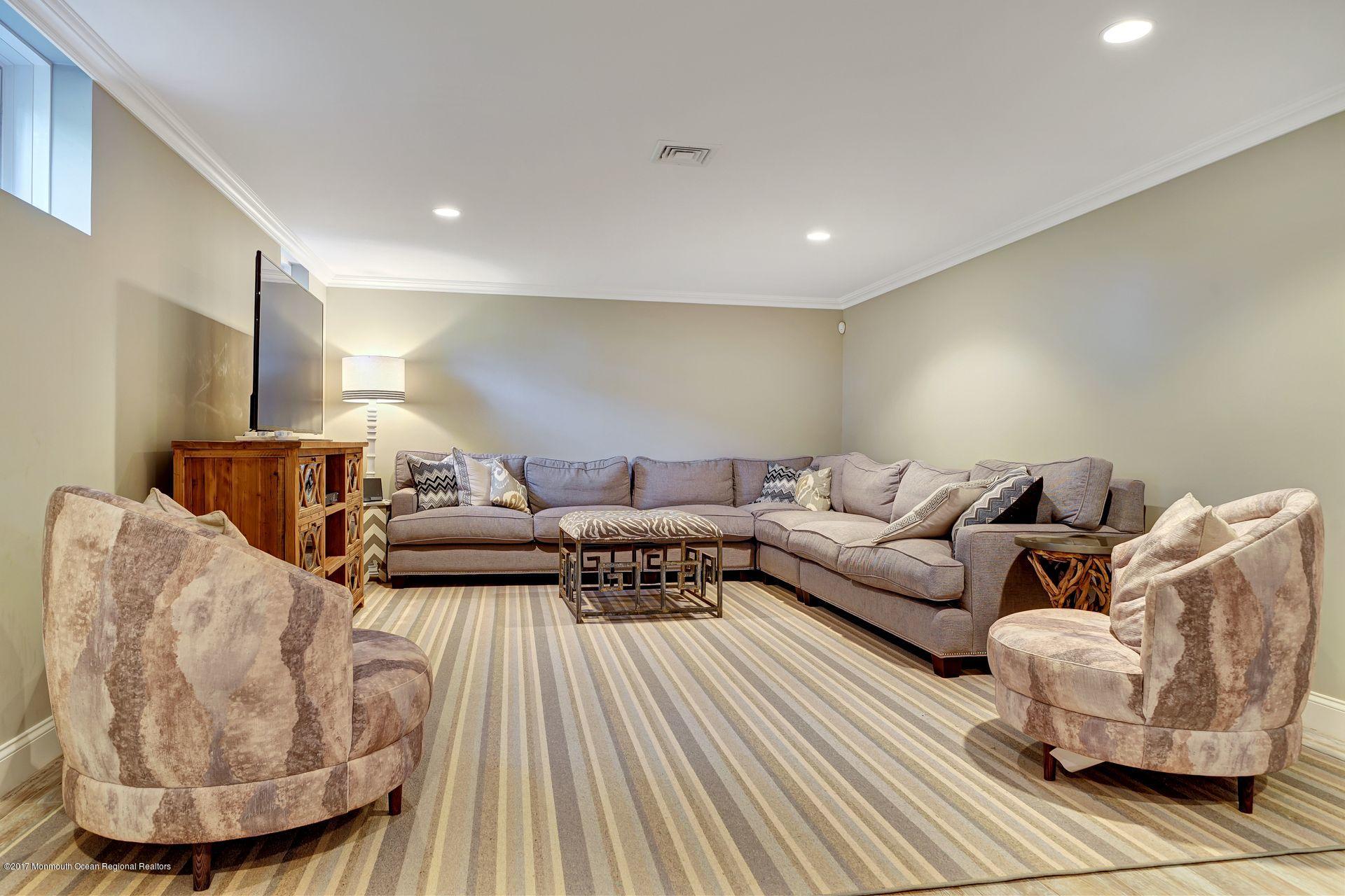 401 Monmouth Avenue Spring Lake, NJ 07762 - Photo 23 of 24 a living room with furniture and a wooden floor