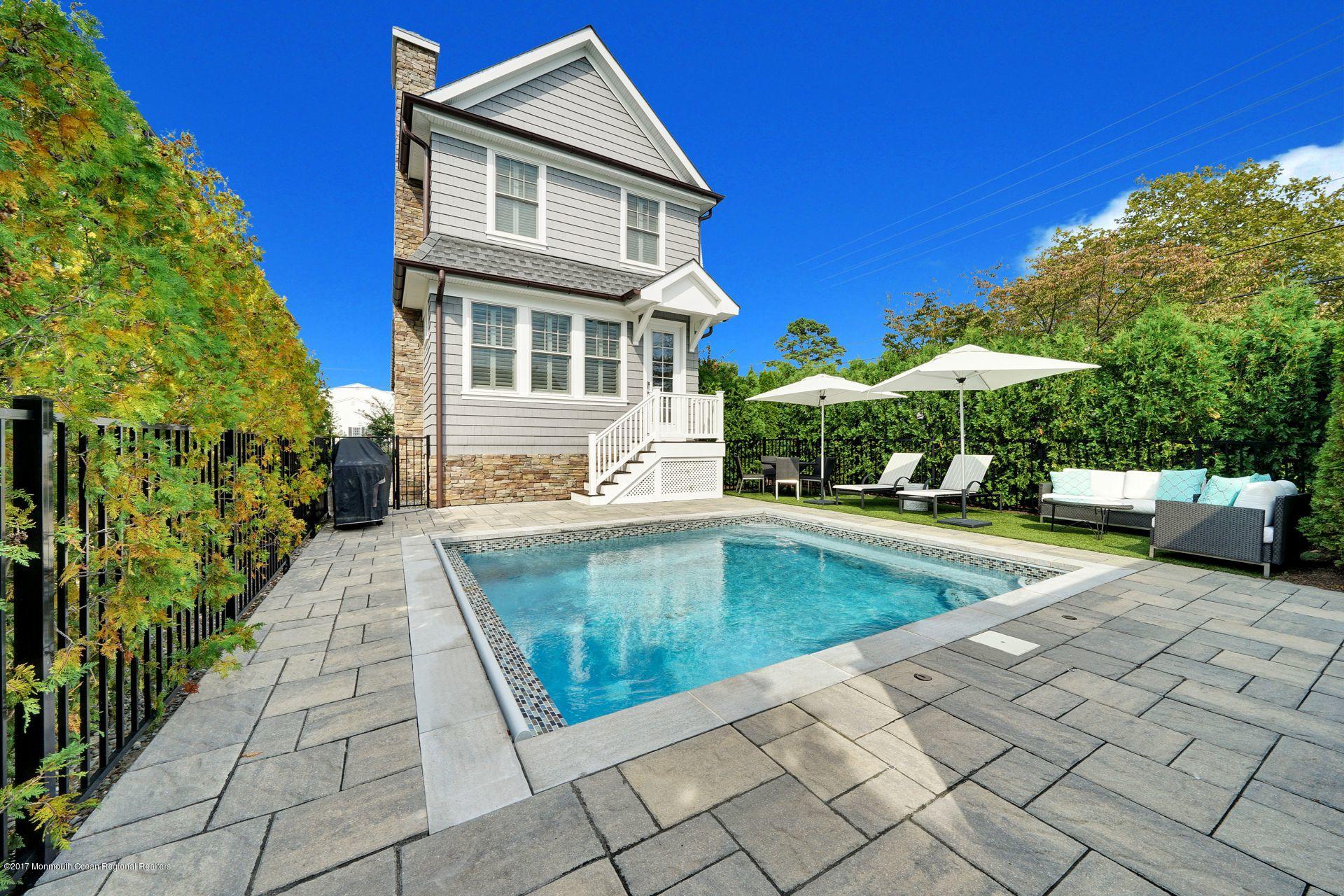 401 Monmouth Avenue Spring Lake, NJ 07762 - Photo 5 of 24 a view of a house with backyard swimming pool and sitting area