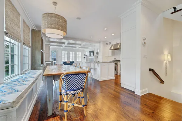 a open kitchen with stainless steel appliances granite countertop a stove refrigerator and cabinets