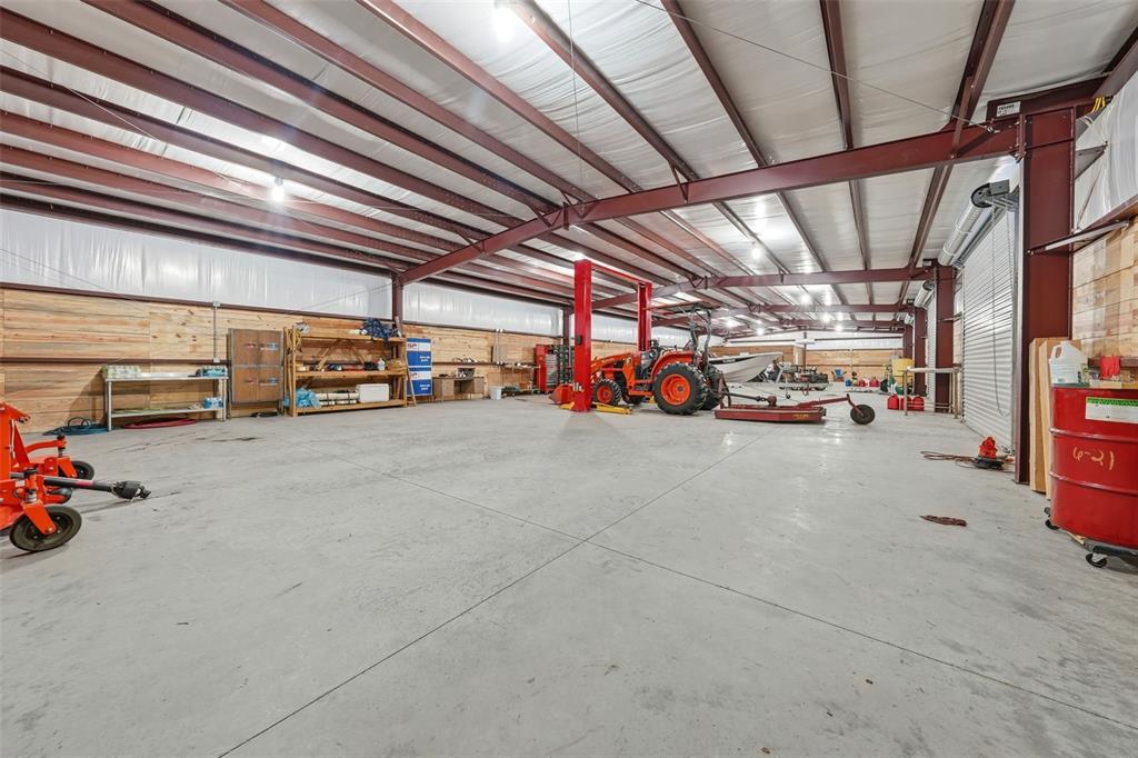 14433 Lake Yale Road Umatilla, FL 32784 - Photo 27 of 38 a view of parking garage with cars