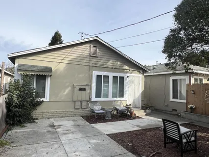 a front view of house with yard outdoor seating