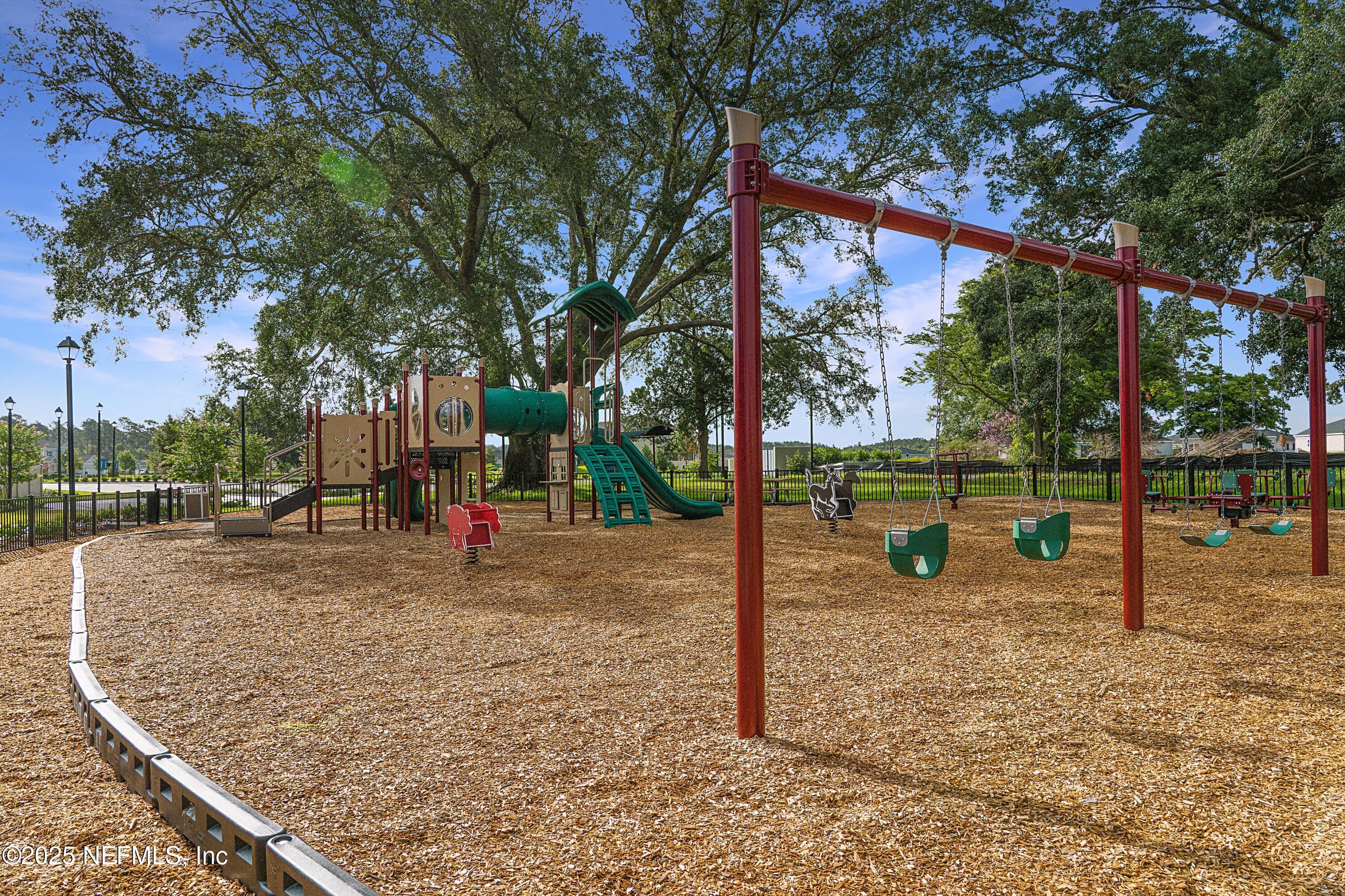 3138 Adelaide Road Green Cove Springs, FL 32043 - Photo 21 of 24 a view of a park with swings