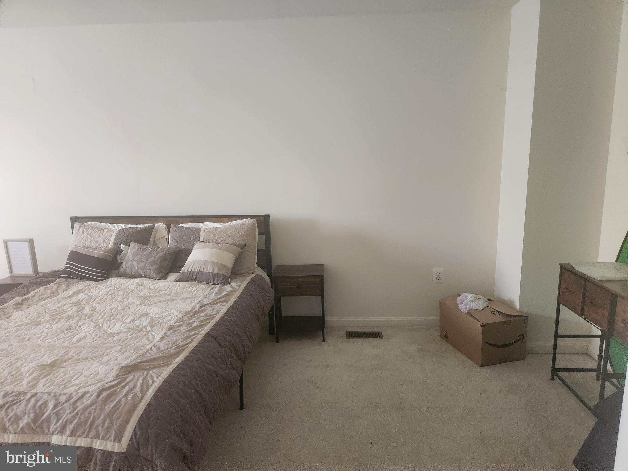 5086 Stapleton Terrace Frederick, MD 21703 - Photo 14 of 24 a bedroom with a bed and chair