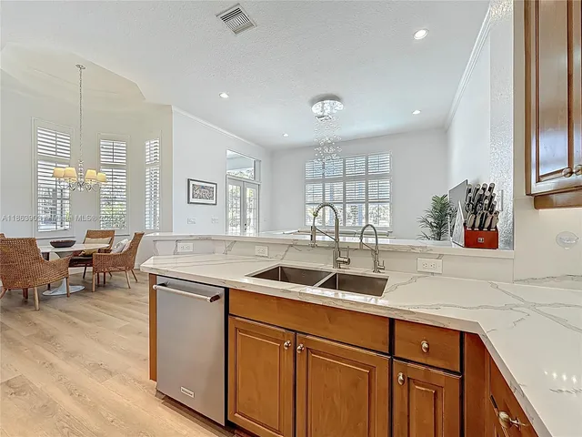 a kitchen with a sink and a microwave