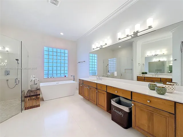 a bathroom with a bathtub and shower