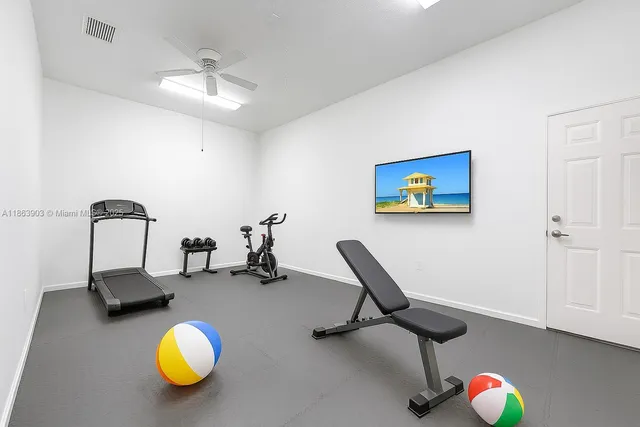 a utility room with sink dryer and washer