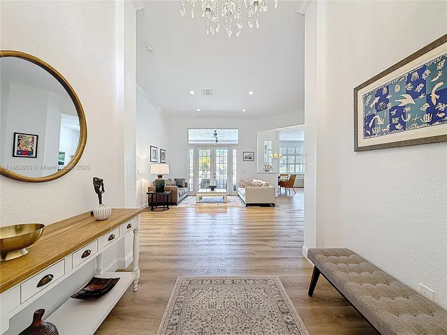 a living room with furniture and large window