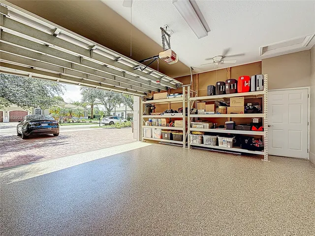a view of a yard with a wooden fence