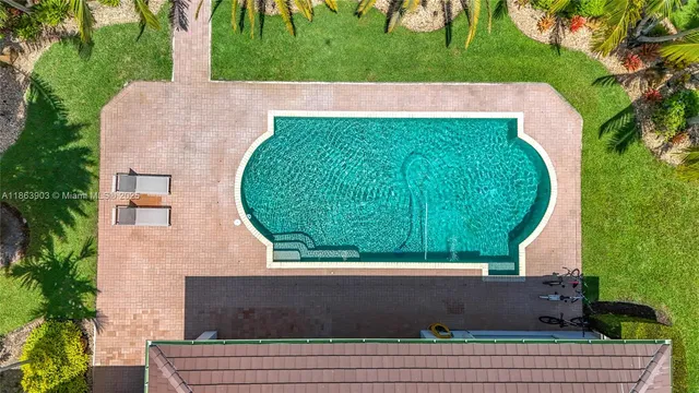an aerial view of a houses with a lake view