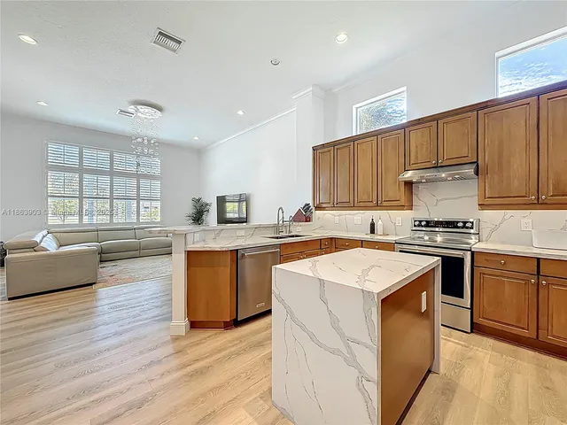 a kitchen with a sink and cabinets