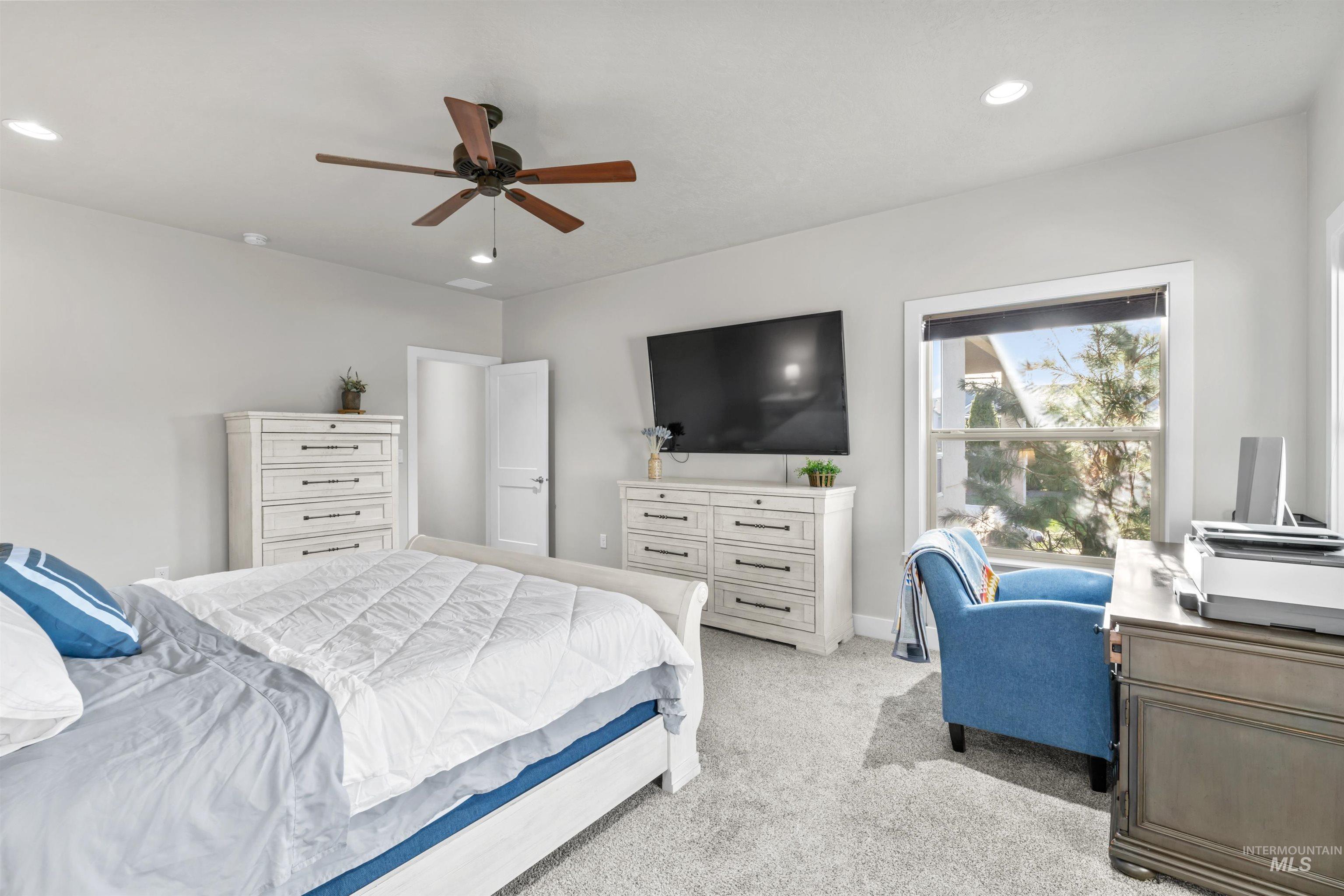 12356 West Rice Road Star, ID 83669 - Photo 17 of 49 Carpeted bedroom featuring a ceiling fan, recessed lighting, and an office area