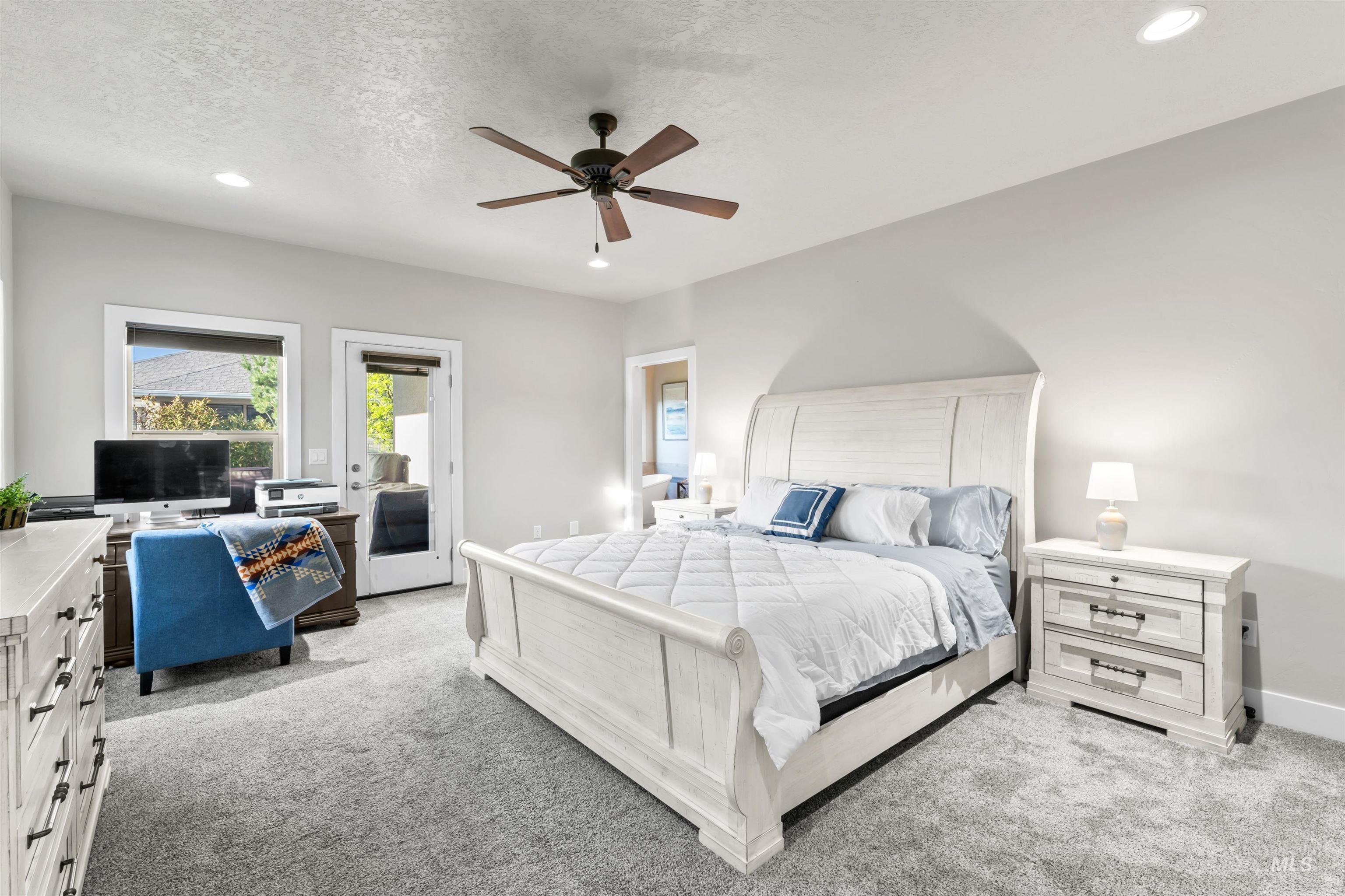 12356 West Rice Road Star, ID 83669 - Photo 18 of 49 Bedroom with light carpet, recessed lighting, access to exterior, ceiling fan, and a textured ceiling