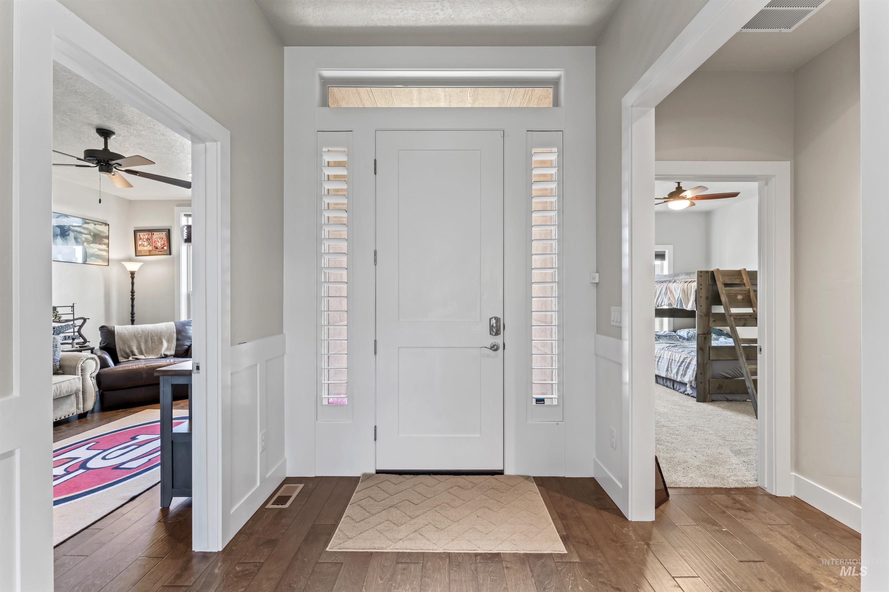 12356 West Rice Road Star, ID 83669 - Photo 27 of 49 Foyer with ceiling fan, hardwood / wood-style flooring, and a textured ceiling