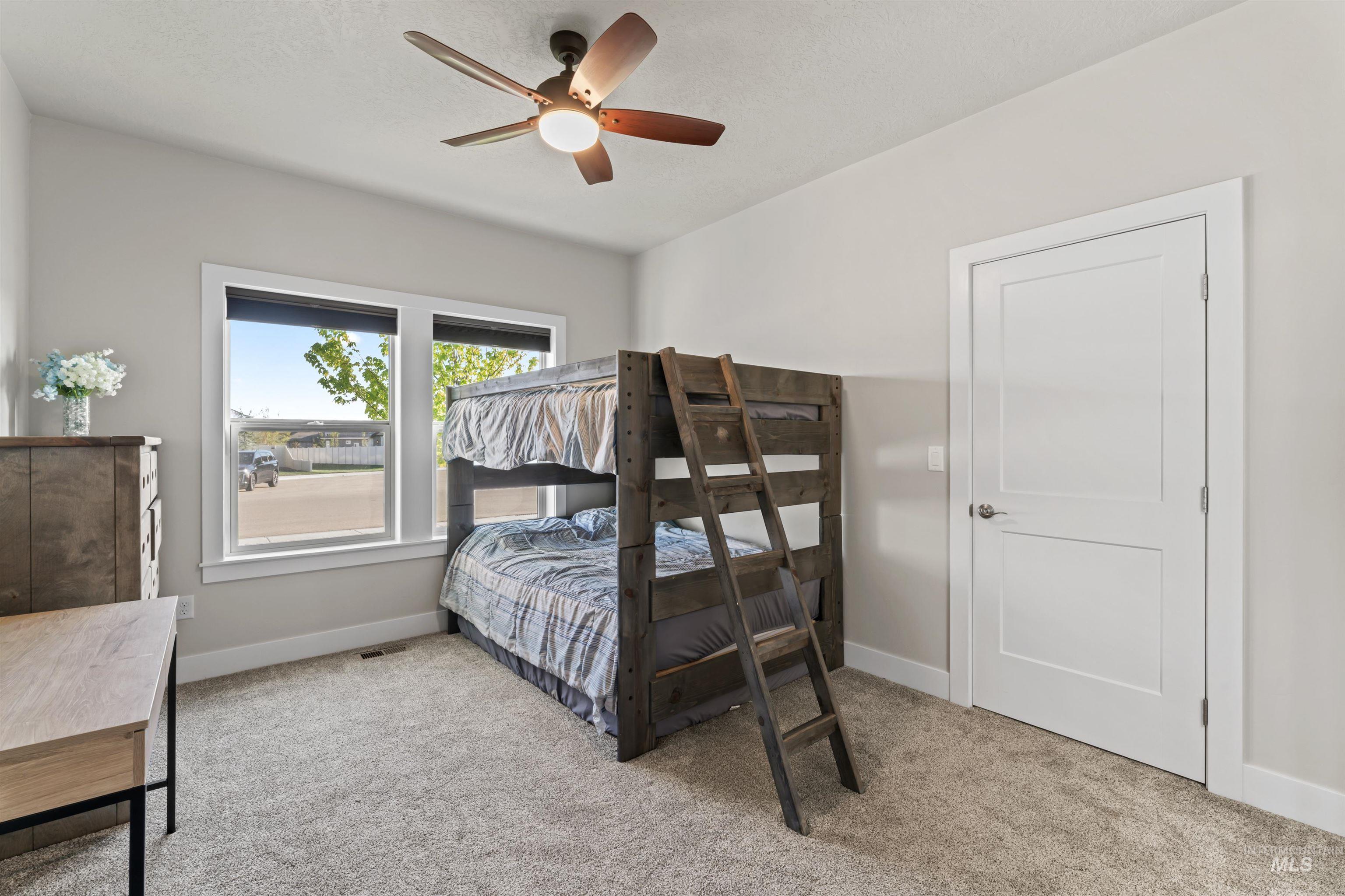 12356 West Rice Road Star, ID 83669 - Photo 28 of 49 Bedroom featuring light colored carpet and ceiling fan