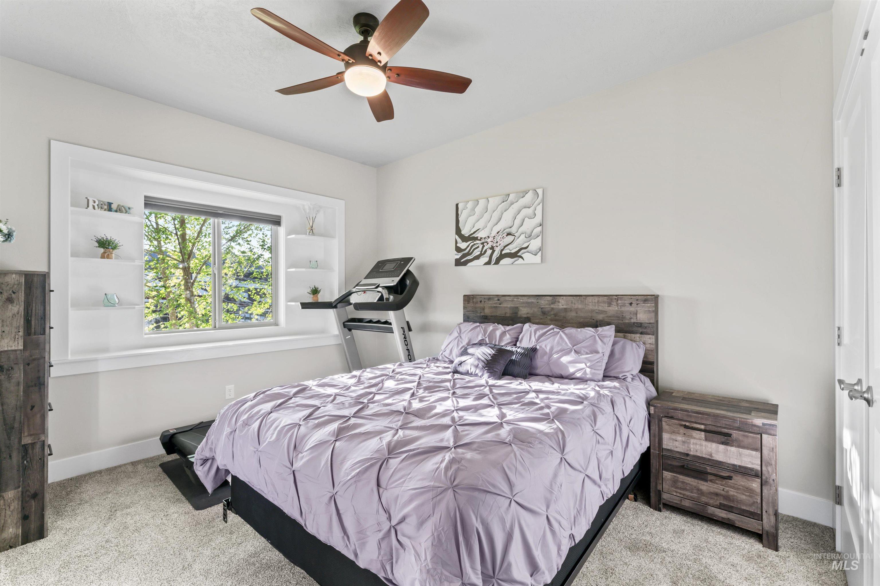 12356 West Rice Road Star, ID 83669 - Photo 35 of 49 Bedroom featuring light carpet and a ceiling fan