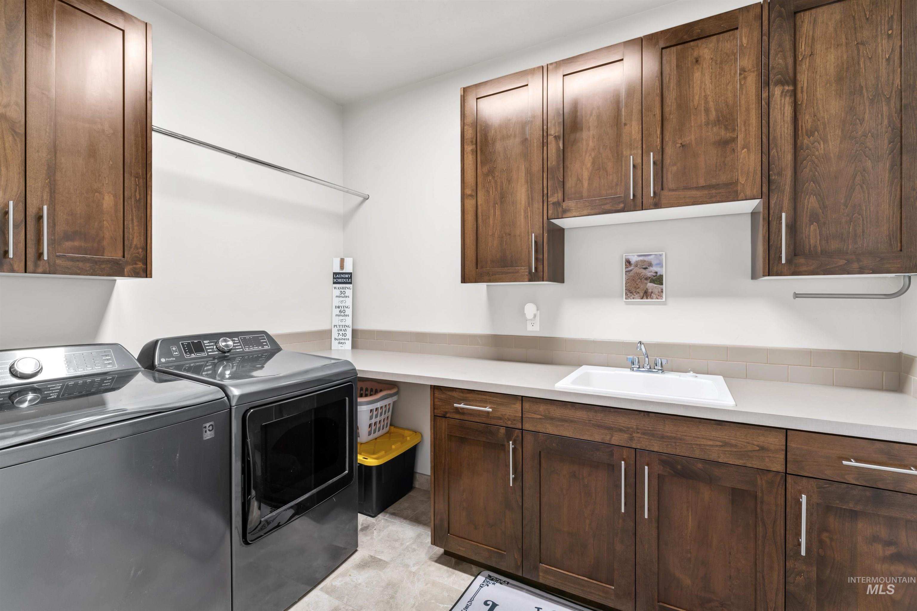 12356 West Rice Road Star, ID 83669 - Photo 36 of 49 Laundry area featuring cabinet space and separate washer and dryer