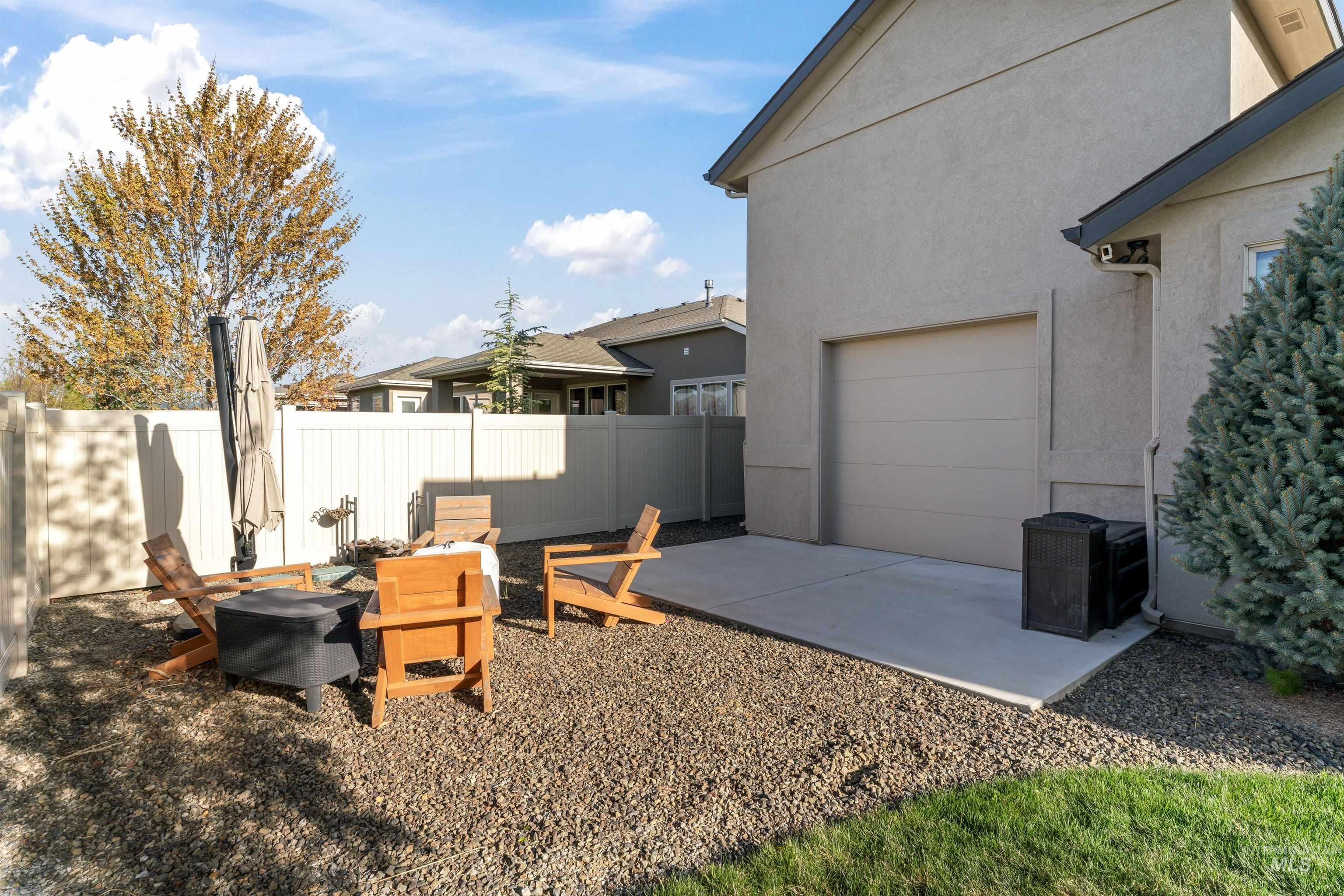 12356 West Rice Road Star, ID 83669 - Photo 41 of 49 View of yard featuring a patio area and a garage