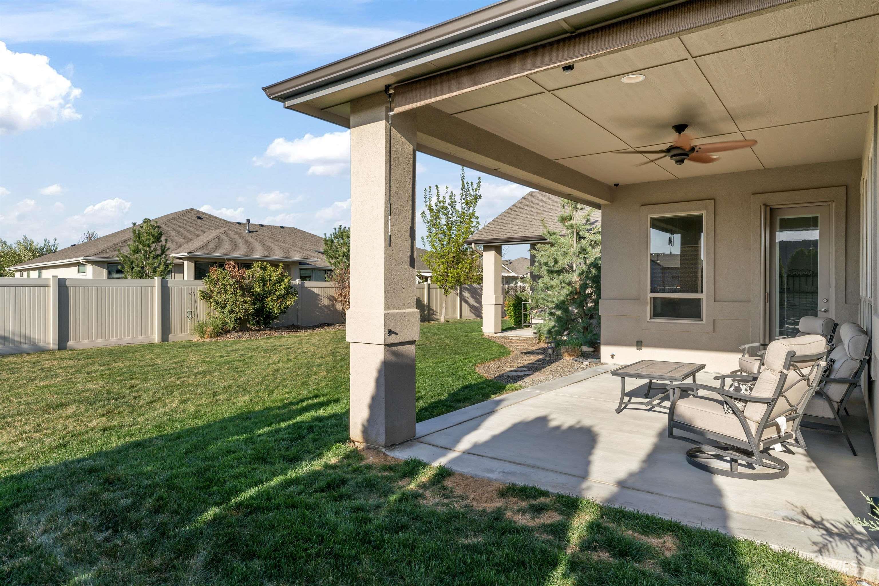 12356 West Rice Road Star, ID 83669 - Photo 42 of 49 Fenced backyard with ceiling fan and a patio area