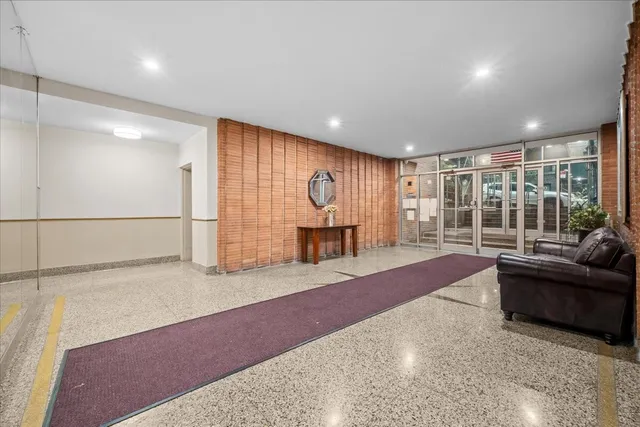 a spacious bedroom with a bed and a couch