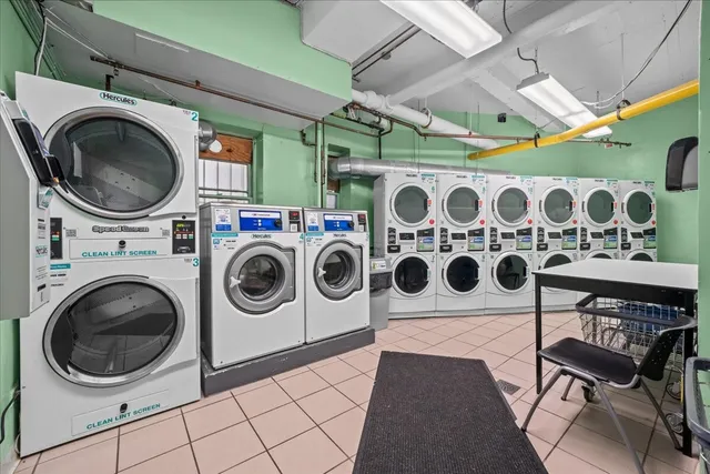 a backyard of a house with fountain table and chairs