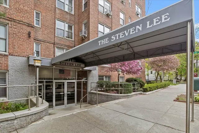 a front view of a building with parking space