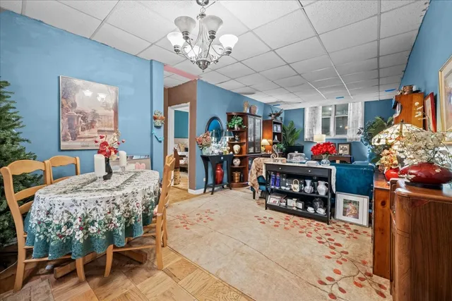 a bedroom with furniture and a chandelier