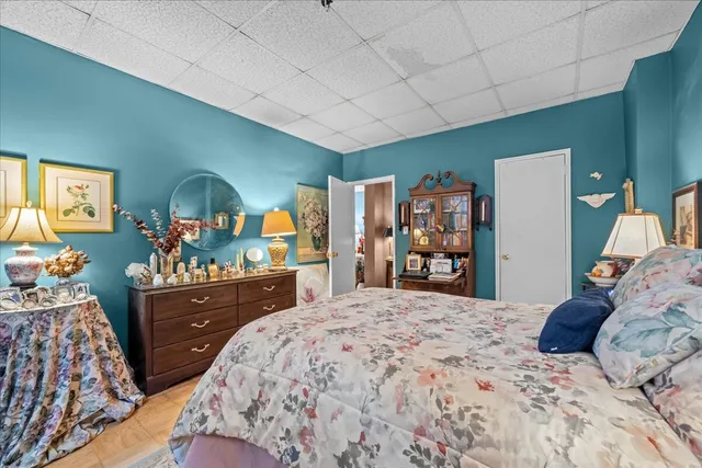 a bedroom with bed and a couch