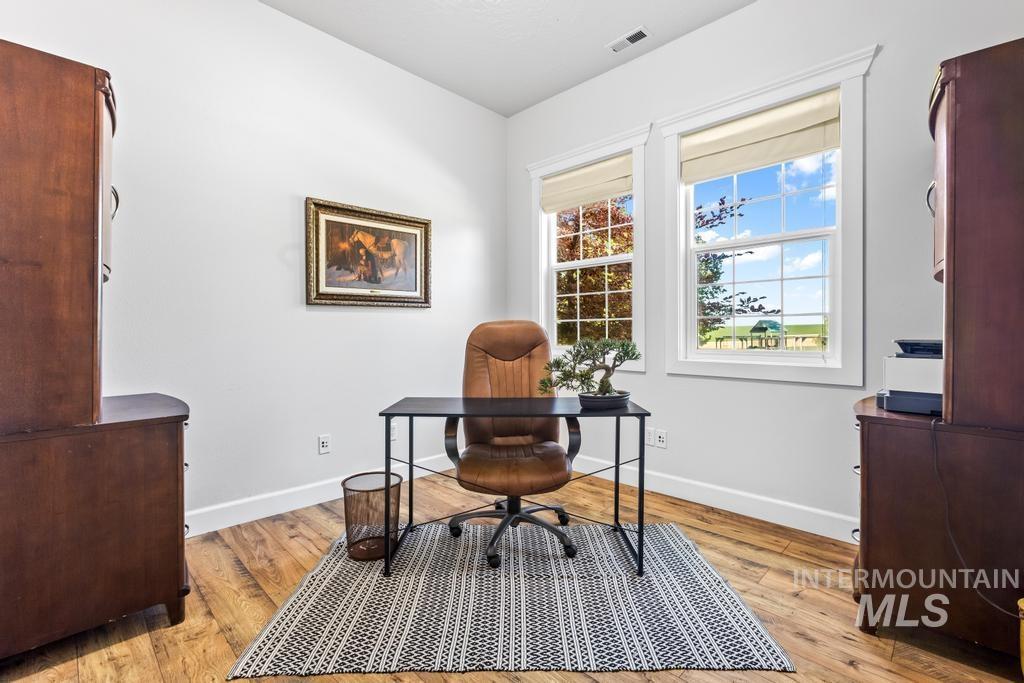 28279 Pearl Road Parma, ID 83660 - Photo 12 of 46 Home office featuring light wood finished floors and baseboards