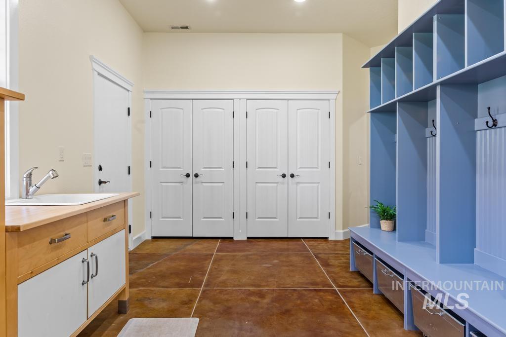 28279 Pearl Road Parma, ID 83660 - Photo 27 of 46 Mudroom with a sink and dark tile patterned floors