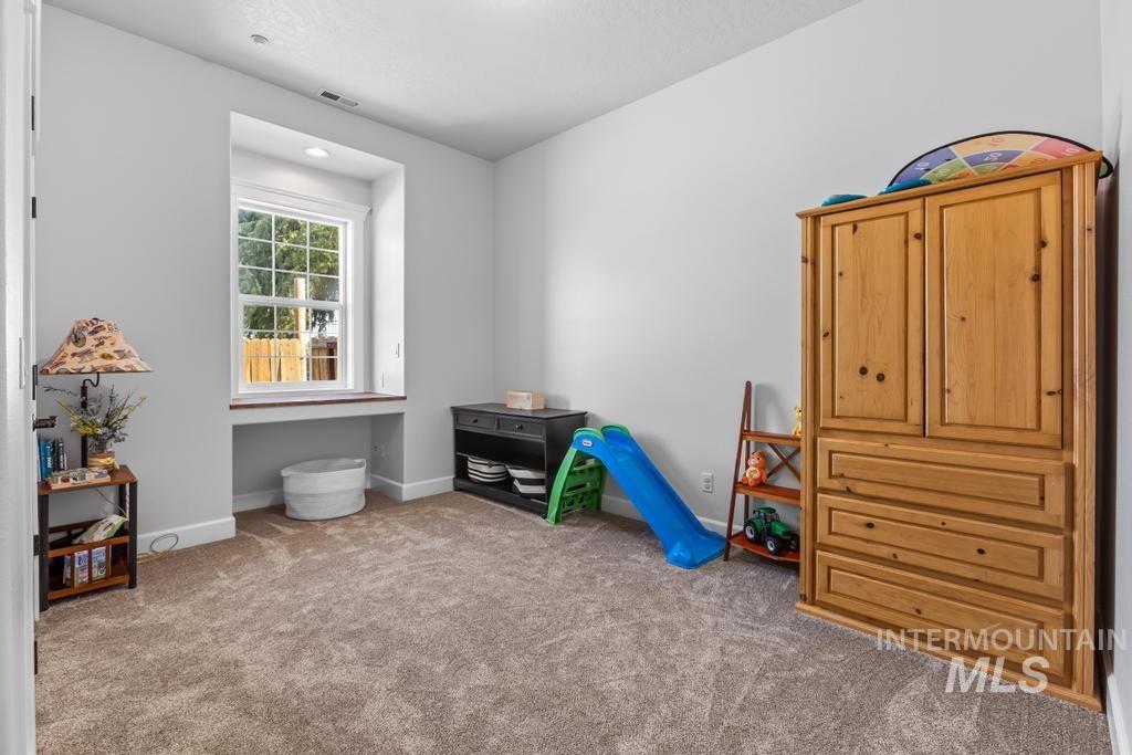 28279 Pearl Road Parma, ID 83660 - Photo 31 of 46 Recreation room with light colored carpet and baseboards