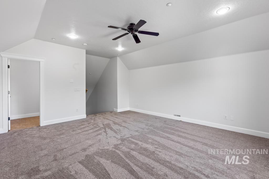 28279 Pearl Road Parma, ID 83660 - Photo 43 of 46 Additional living space featuring lofted ceiling, light colored carpet, a ceiling fan, and recessed lighting
