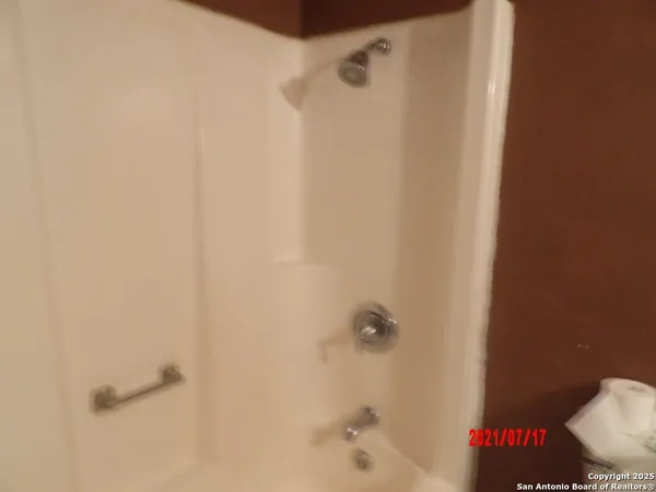 a bath room with a shower