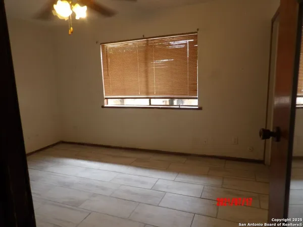 a view of an empty room with a window