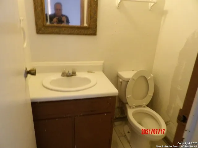 a bathroom with a toilet and a sink