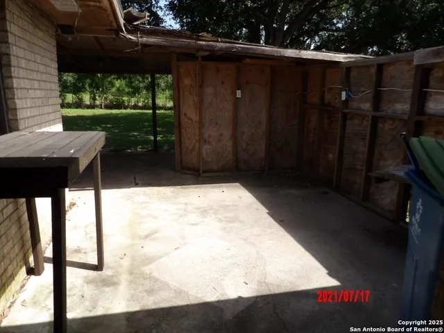 a view of a porch and garden