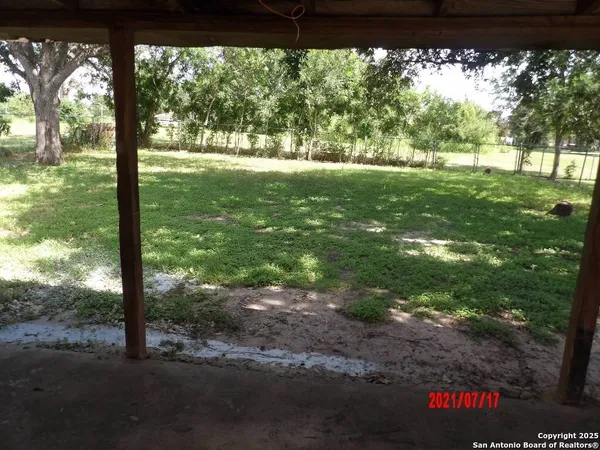a backyard of a house with lots of green space