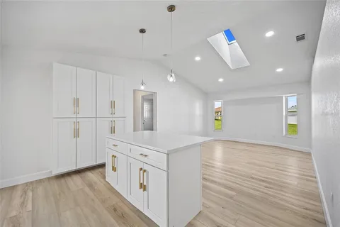 a kitchen with stainless steel appliances a refrigerator and a stove