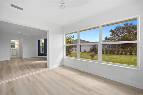 a spacious bathroom with a double vanity sink a mirror and a bathtub