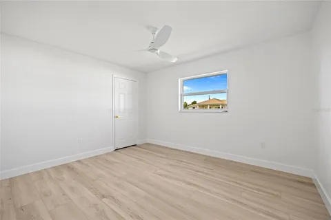 an empty room with a painting on the wall
