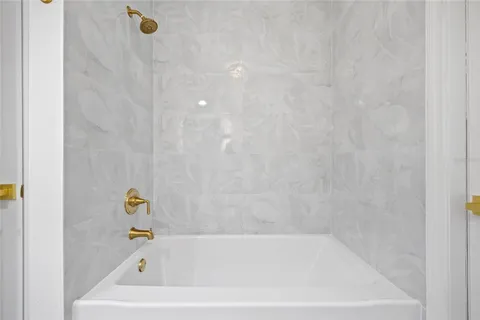 a bathroom with a sink toilet and mirror