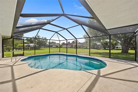 a view of swimming pool with an outdoor seating
