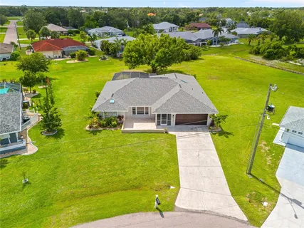 a picture of a bathroom with a sink a mirror and a picture of it