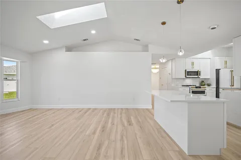 a view of kitchen with wooden floor