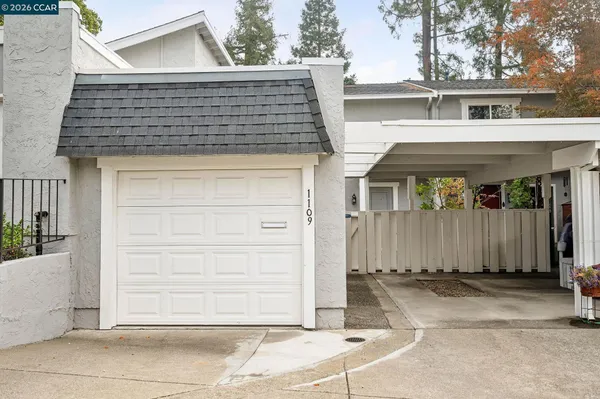 a front view of a house with a garage