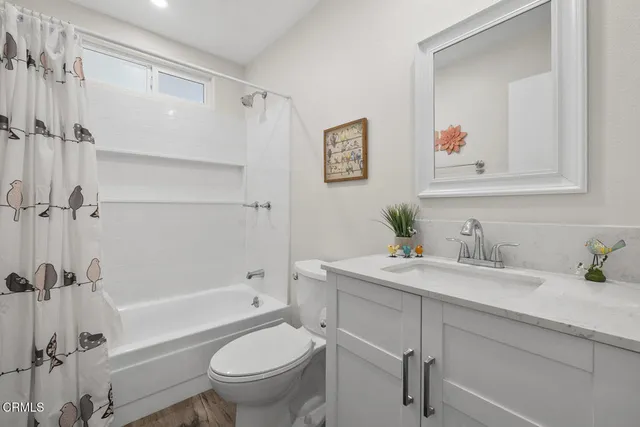a bathroom with a sink a toilet and a bathtub