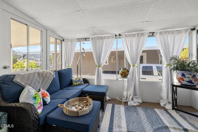 a living room with furniture and a table