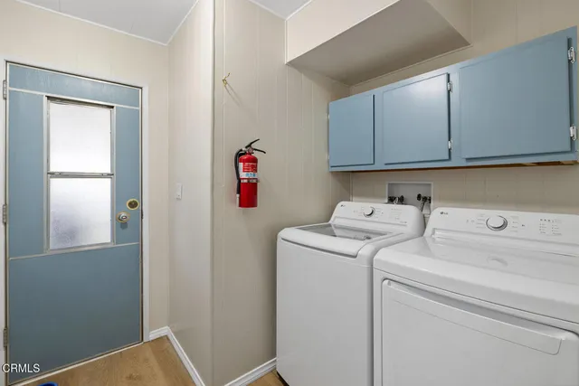 a view of storage and utility room with washer and dryer