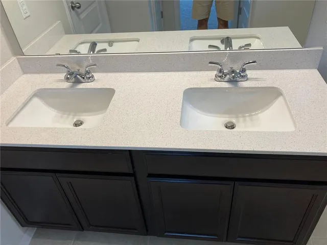 a bathroom with a glass shower door