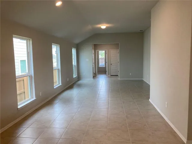 a view of a hallway with windows